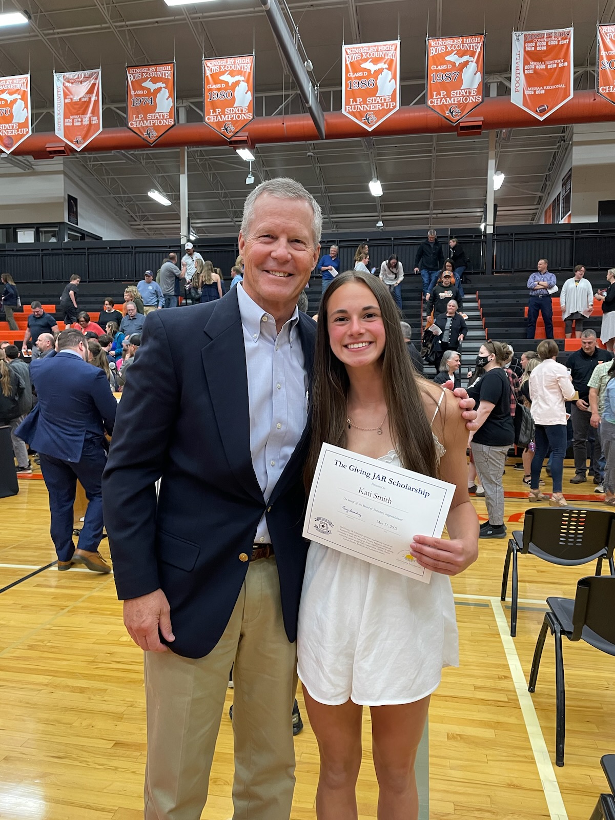 2023 Giving JAR Scholarship award winner, Kati Smith from Kingsley High School with Tom Raymond