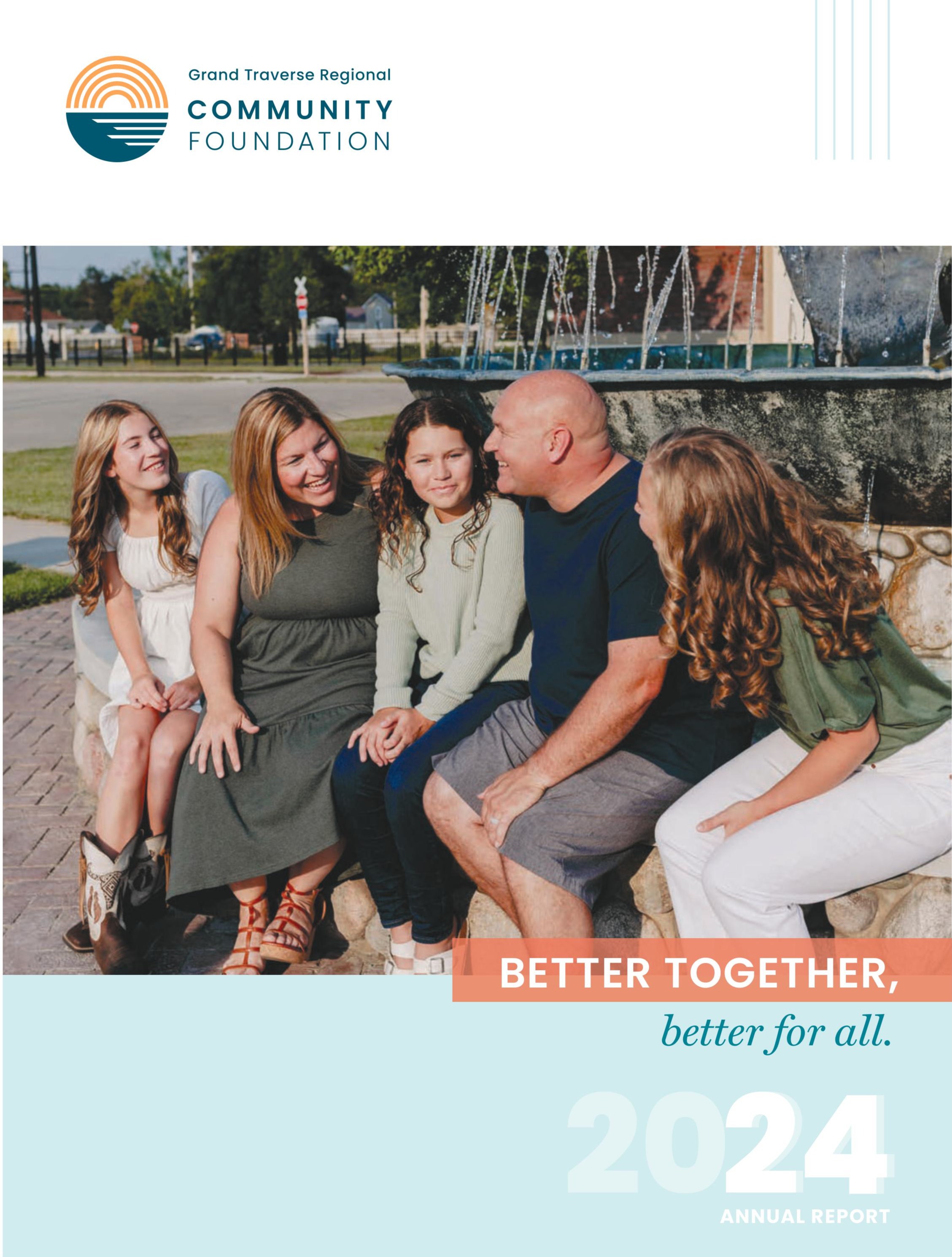 A family of five sitting together at the Village of Kalkaska trout water foundation
